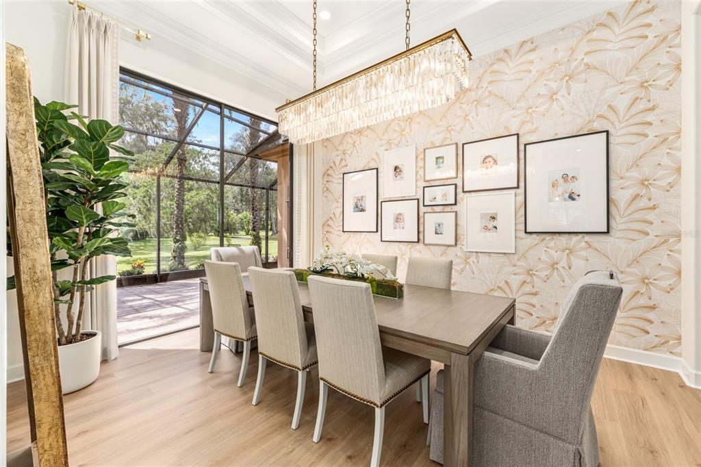 708 Southeast 44th Road Ocala, FL 34480 - Photo 28 of 76 a view of a dining room with furniture a potted plant and wooden floor
