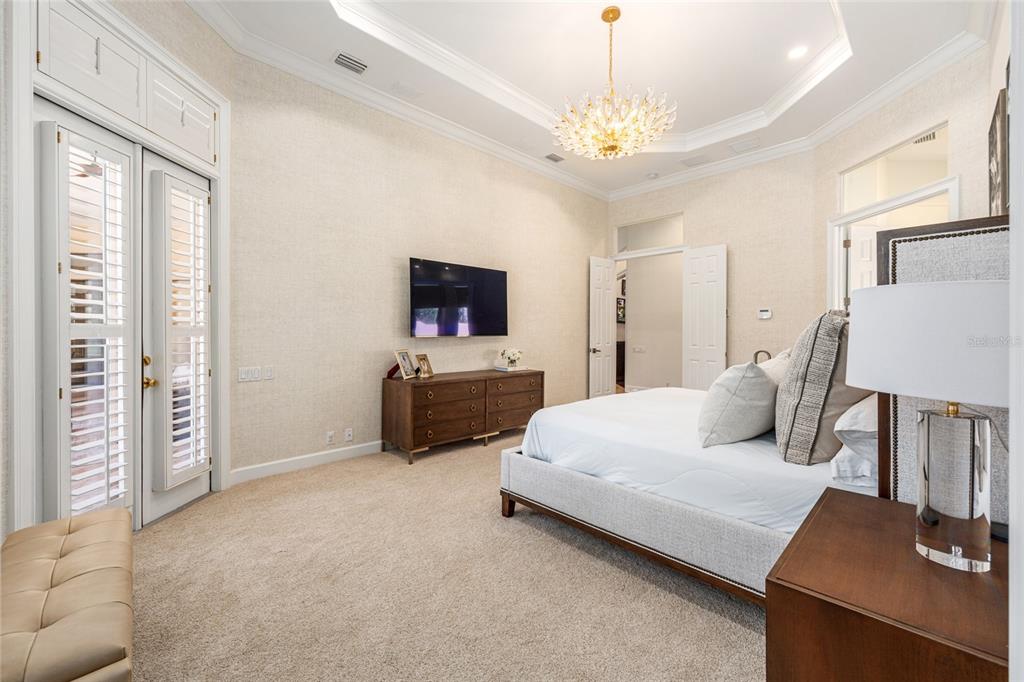 708 Southeast 44th Road Ocala, FL 34480 - Photo 33 of 76 a living room with furniture and a chandelier