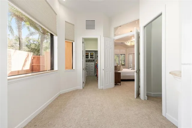 a bedroom with furniture and a chandelier