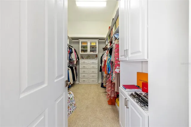 a living room with couches and a large window with garden view