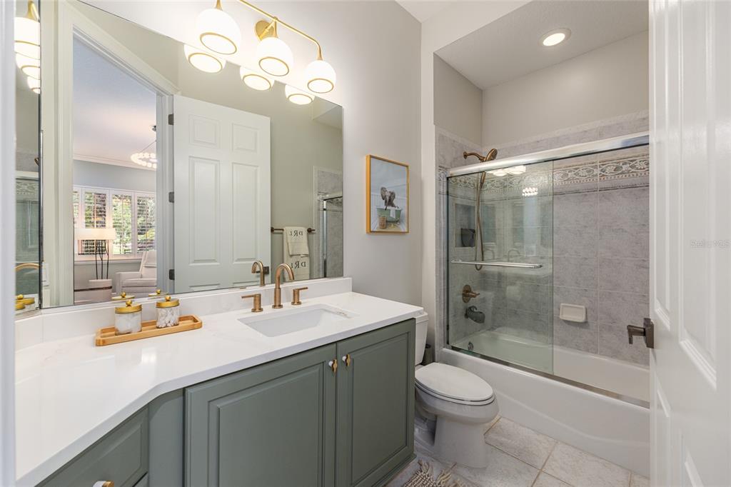 708 Southeast 44th Road Ocala, FL 34480 - Photo 50 of 76 a bathroom with a sink a toilet and shower