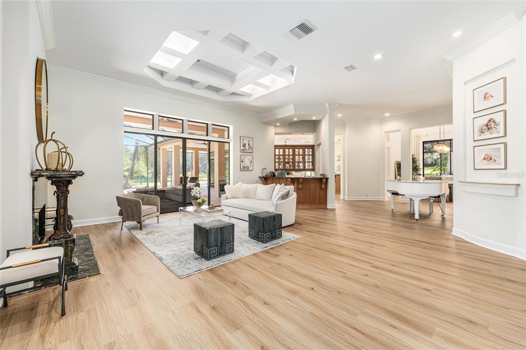 708 Southeast 44th Road Ocala, FL 34480 - Photo 6 of 76 a living room with furniture and a wooden floor