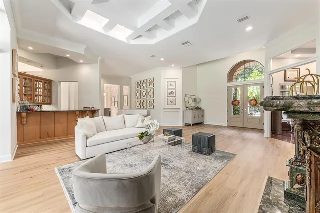a living room with fireplace furniture and a wooden floor