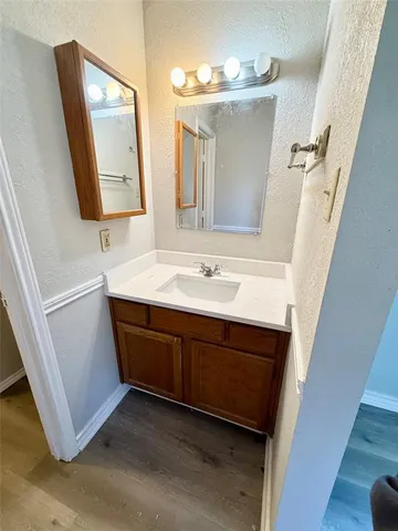 a view of a room with a window and ceiling fan