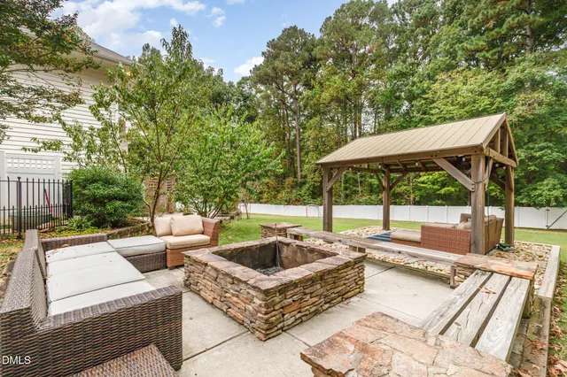 a view of a dining room with furniture wooden floor and chandelier