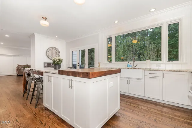 a kitchen with stainless steel appliances granite countertop a stove and a refrigerator