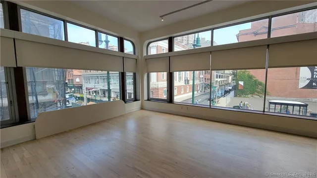 a view of an empty room with a large window