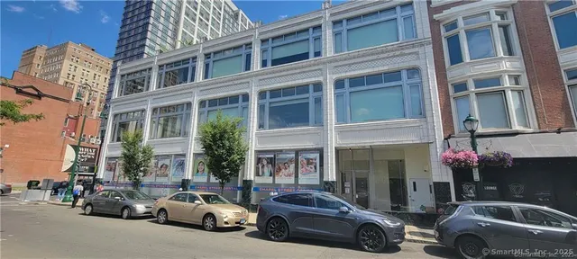 a car parked in front of a building