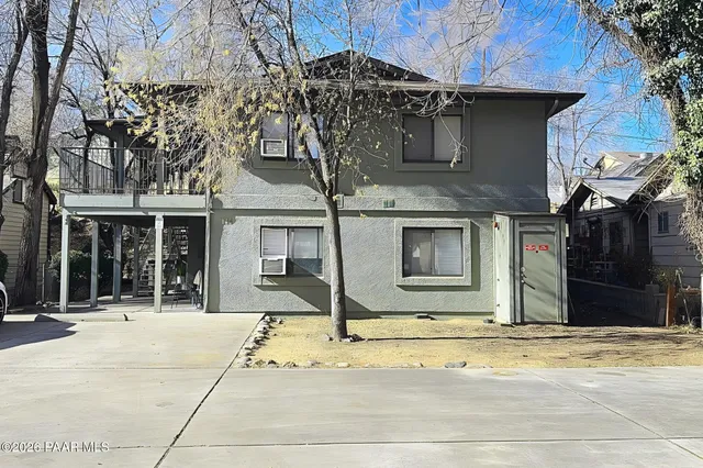 a house with trees in front of it