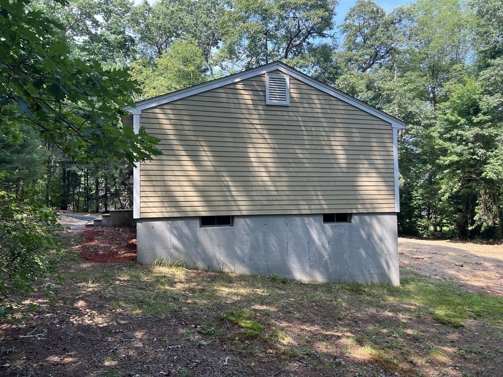 290 Little Alum Road Brimfield, MA 01010 - Photo 5 of 42 a front view of a house with a yard