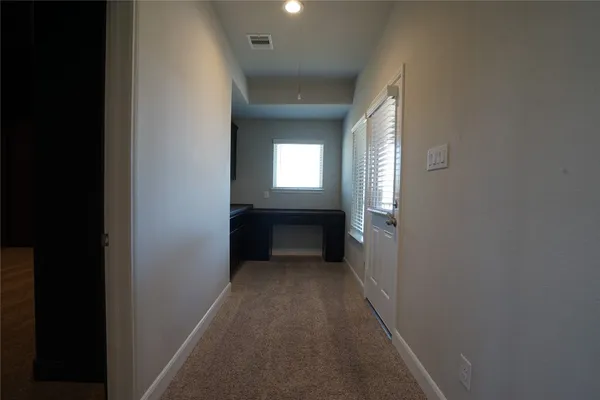 a view of a livingroom with a ceiling fan and window