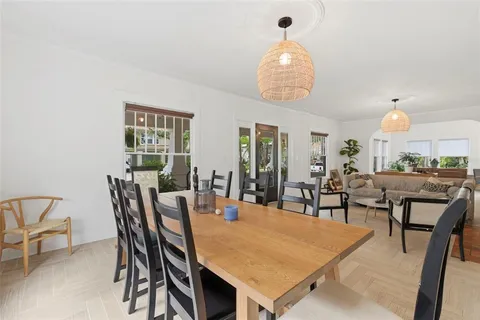 a kitchen with kitchen island stainless steel appliances a sink stove and refrigerator