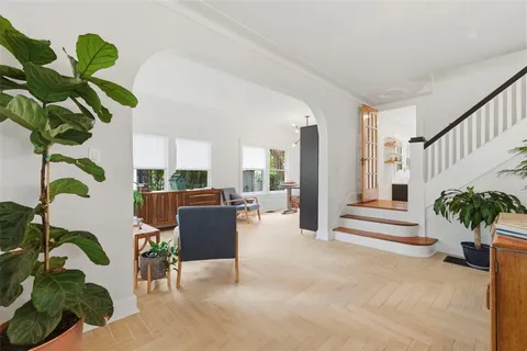 a view of a dining room with furniture window and wooden floor