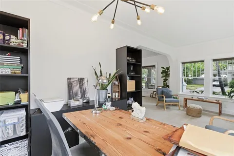 a kitchen with stainless steel appliances a sink a refrigerator and a stove