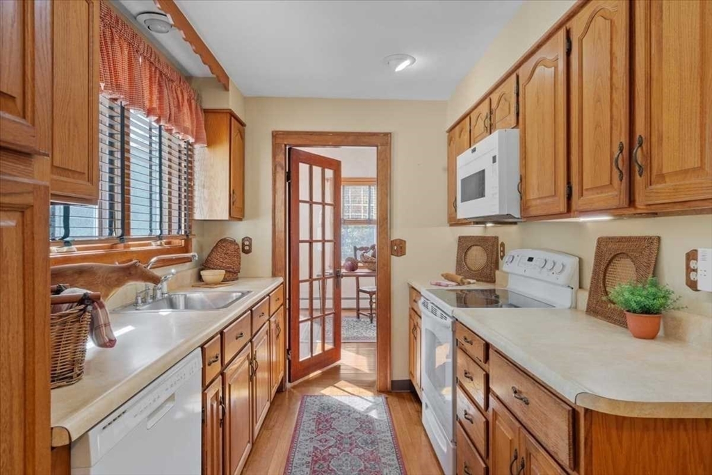 30 Tobin Road Leicester, MA 01611 - Photo 11 of 33 a kitchen with stainless steel appliances granite countertop a sink stove and cabinets