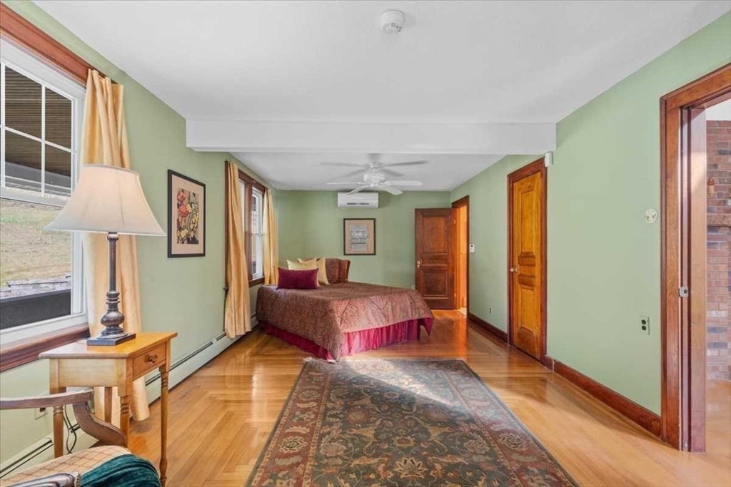 30 Tobin Road Leicester, MA 01611 - Photo 16 of 33 a bedroom with a bed and wooden floor