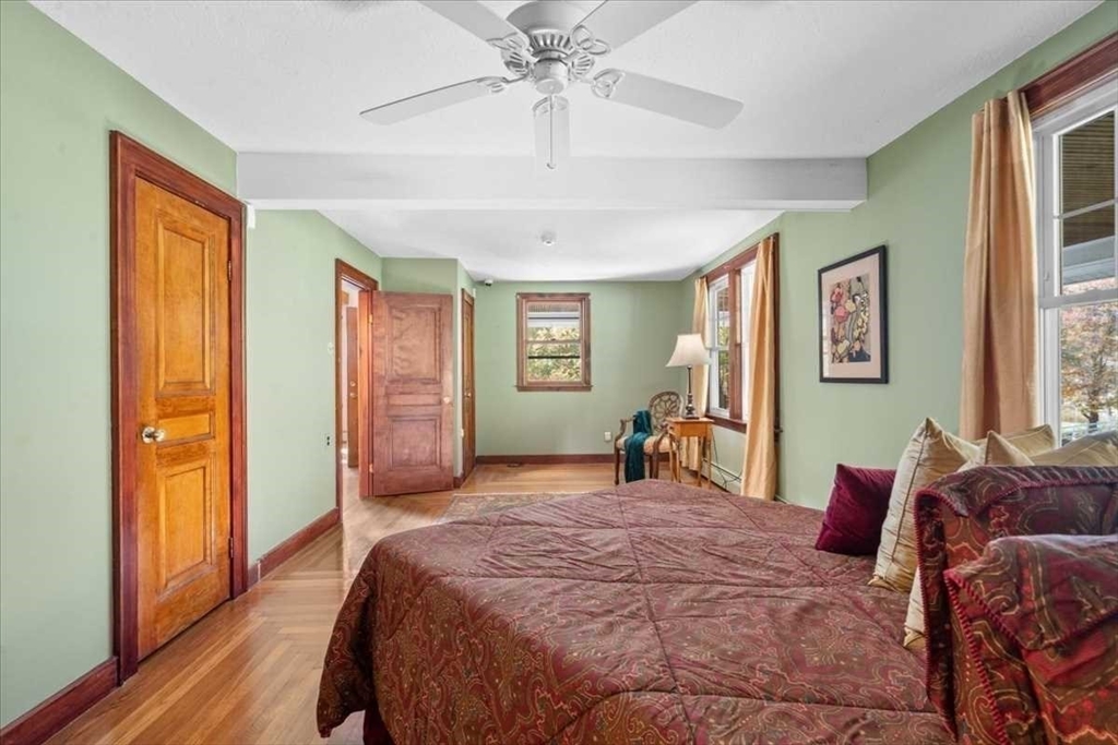 30 Tobin Road Leicester, MA 01611 - Photo 17 of 33 a bedroom with a large bed and a window