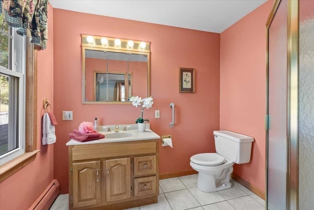 30 Tobin Road Leicester, MA 01611 - Photo 19 of 33 a bathroom with a sink vanity mirror and toilet