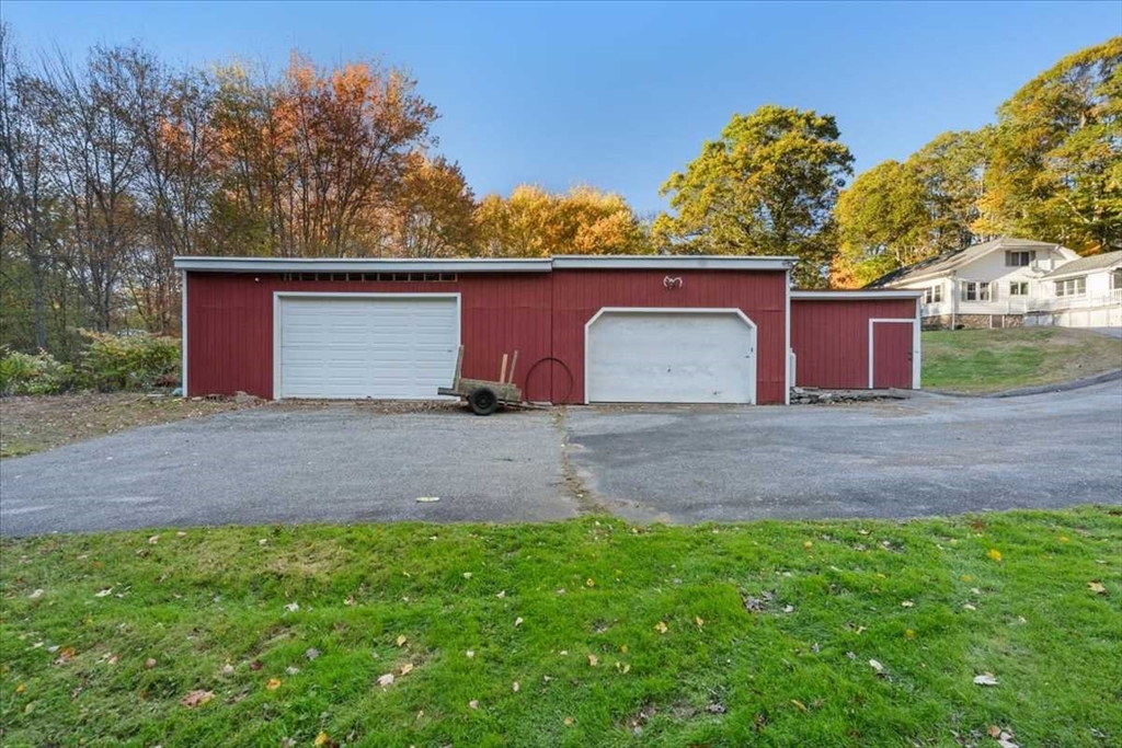 30 Tobin Road Leicester, MA 01611 - Photo 33 of 33 a front view of a house with a yard and garage
