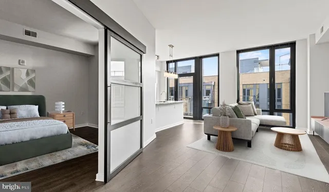 a living room with furniture and a large window