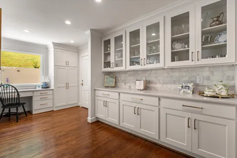 a kitchen with a sink cabinets and window