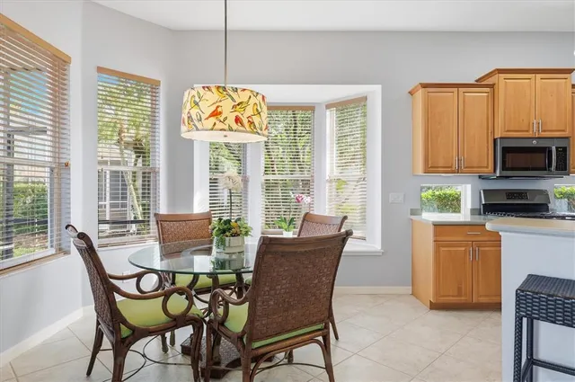 a bedroom with furniture and a large window