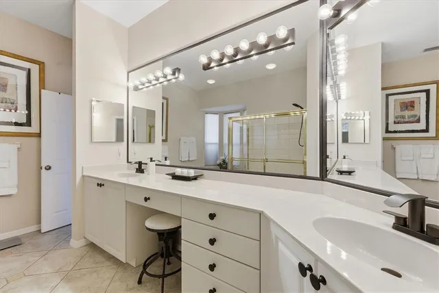 a bedroom with a bed couch and window