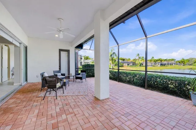 an aerial view of residential houses with outdoor space and seating