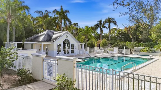 a view of a swimming pool with an outdoor space and seating area