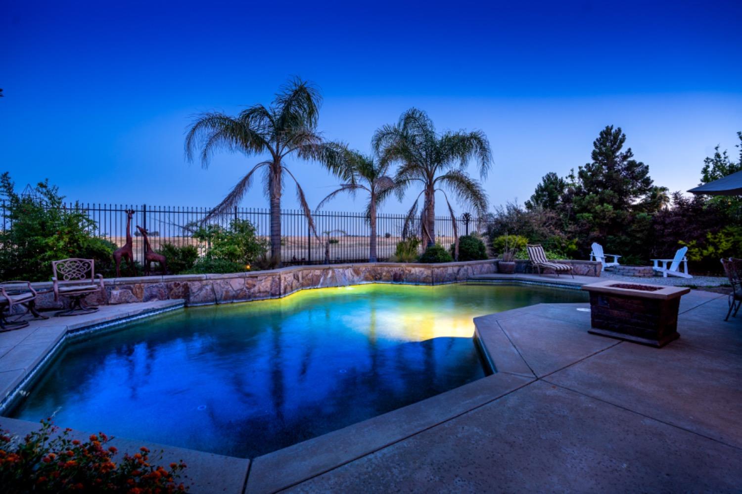 a view of a swimming pool with an outdoor space and seating area