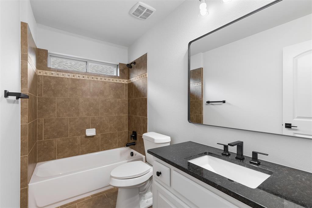 11984 Del Rio Drive Frisco, TX 75035 - Photo 32 of 38 Full bath featuring vanity, toilet, visible vents, bathtub / shower combination, and tile patterned flooring