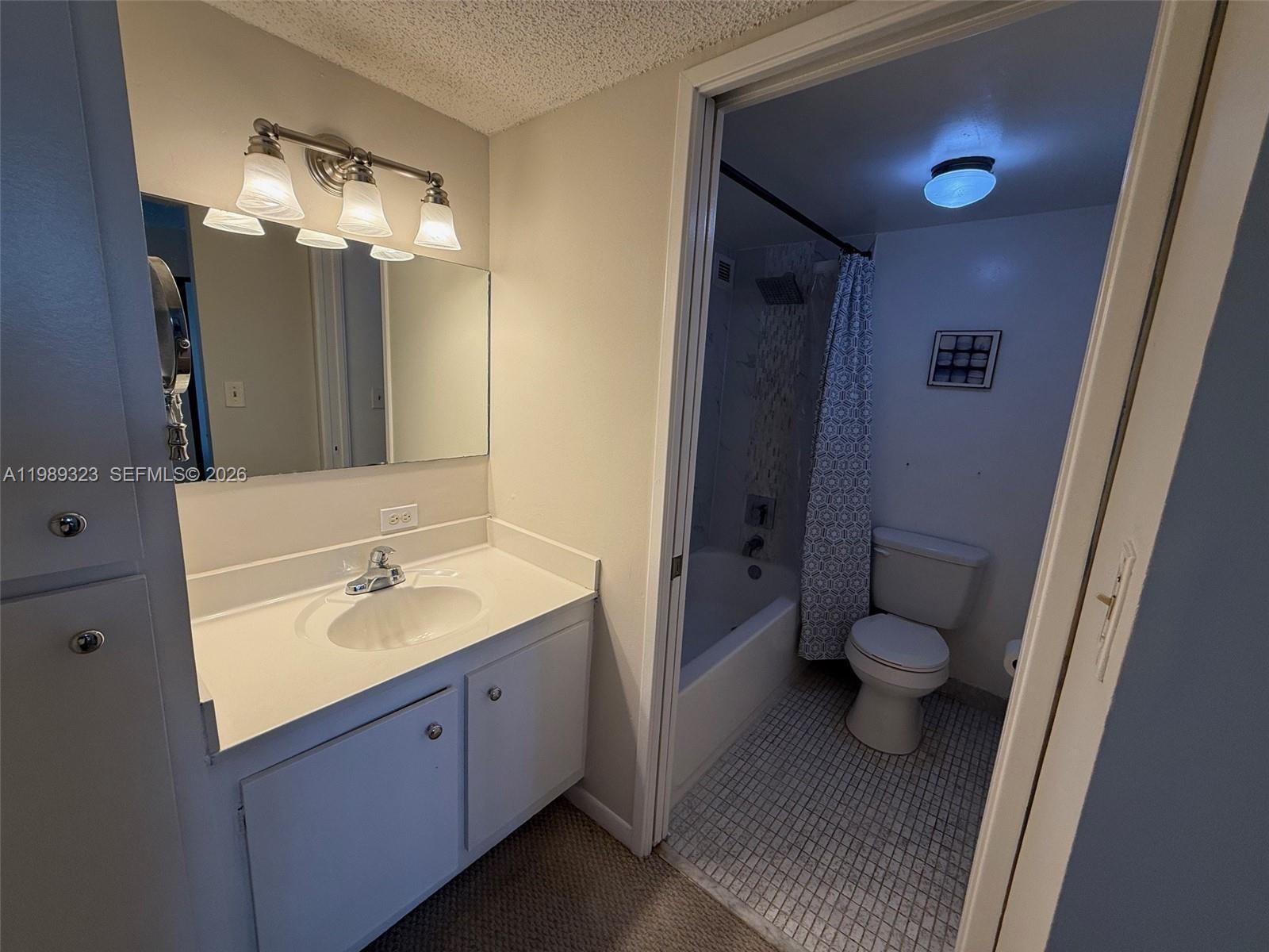 17011 North Bay Road, Unit 1007 Sunny Isles Beach, FL 33160 - Photo 21 of 28 a bathroom with a sink and a mirror