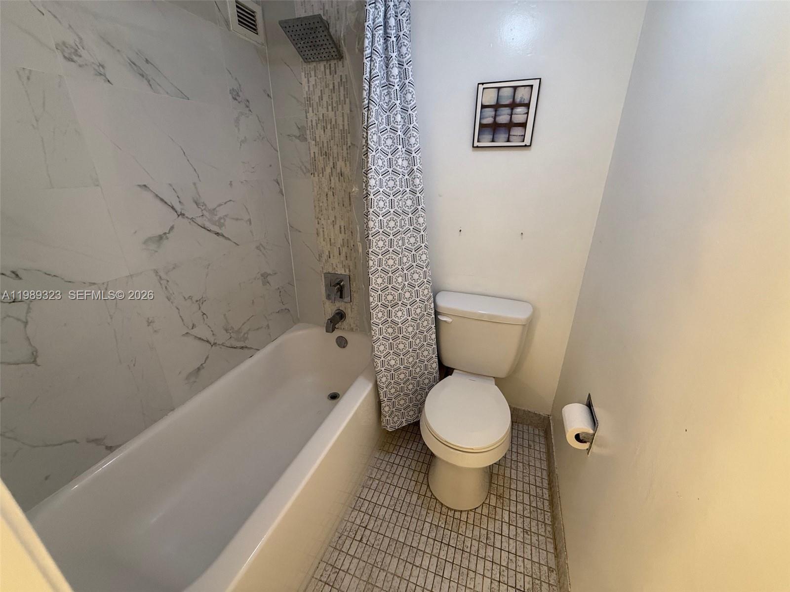 17011 North Bay Road, Unit 1007 Sunny Isles Beach, FL 33160 - Photo 23 of 28 a bathroom with a toilet and a shower