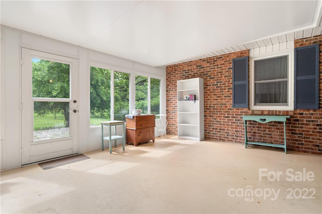 2480 Ridge Road Hendersonville, NC 28792 - Photo 25 of 48 a view of an empty room with a window