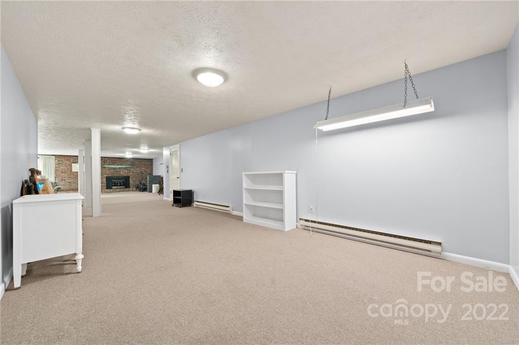 2480 Ridge Road Hendersonville, NC 28792 - Photo 32 of 48 a view of empty room with wooden floor