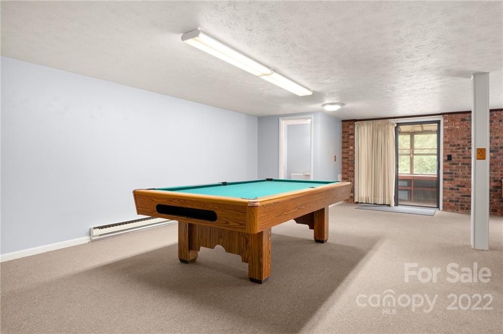 2480 Ridge Road Hendersonville, NC 28792 - Photo 36 of 48 a room with pool table and windows