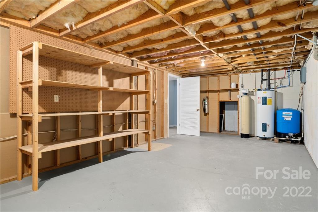 2480 Ridge Road Hendersonville, NC 28792 - Photo 40 of 48 a view of an empty room with a window