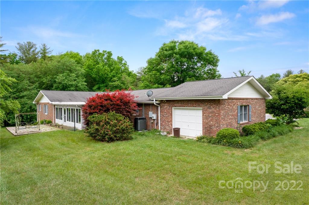 2480 Ridge Road Hendersonville, NC 28792 - Photo 5 of 48 a front view of a house with a yard