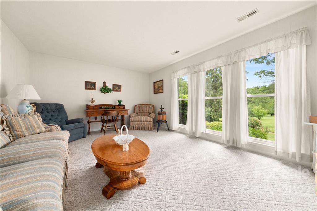 2480 Ridge Road Hendersonville, NC 28792 - Photo 10 of 48 a living room with furniture and a large window