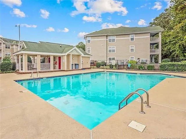 a front view of a house with swimming pool