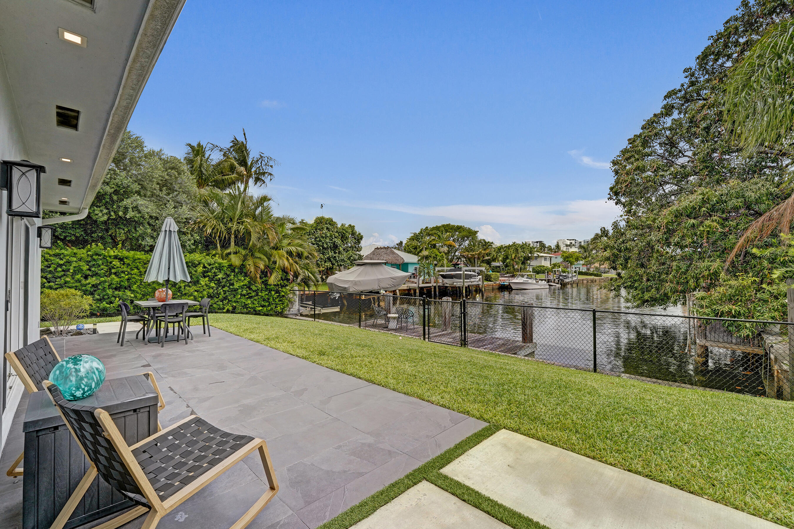 381 Southeast 3rd Street Pompano Beach, FL 33060 - Photo 23 of 41 a view of a backyard with sitting area