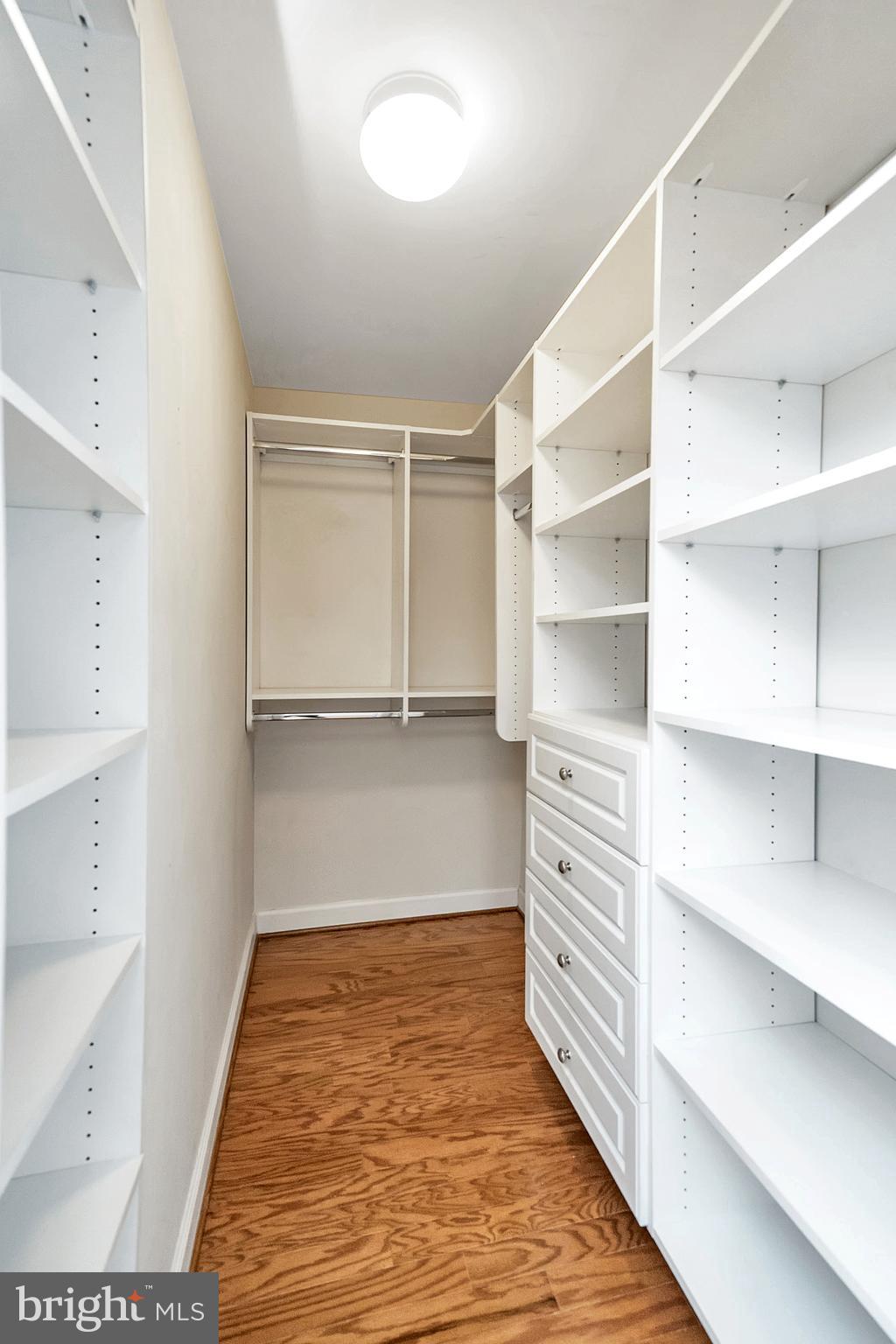 4079 South Four Mile Run Drive, Unit 402 Arlington, VA 22204 - Photo 13 of 30 a view of walk in closet with empty racks