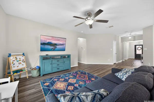 a living room with furniture and a table