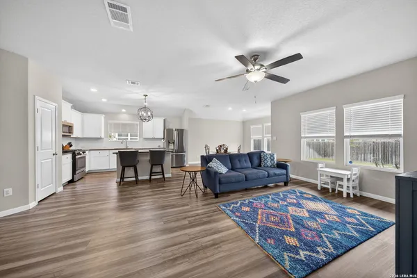 a kitchen with a table and chairs in it