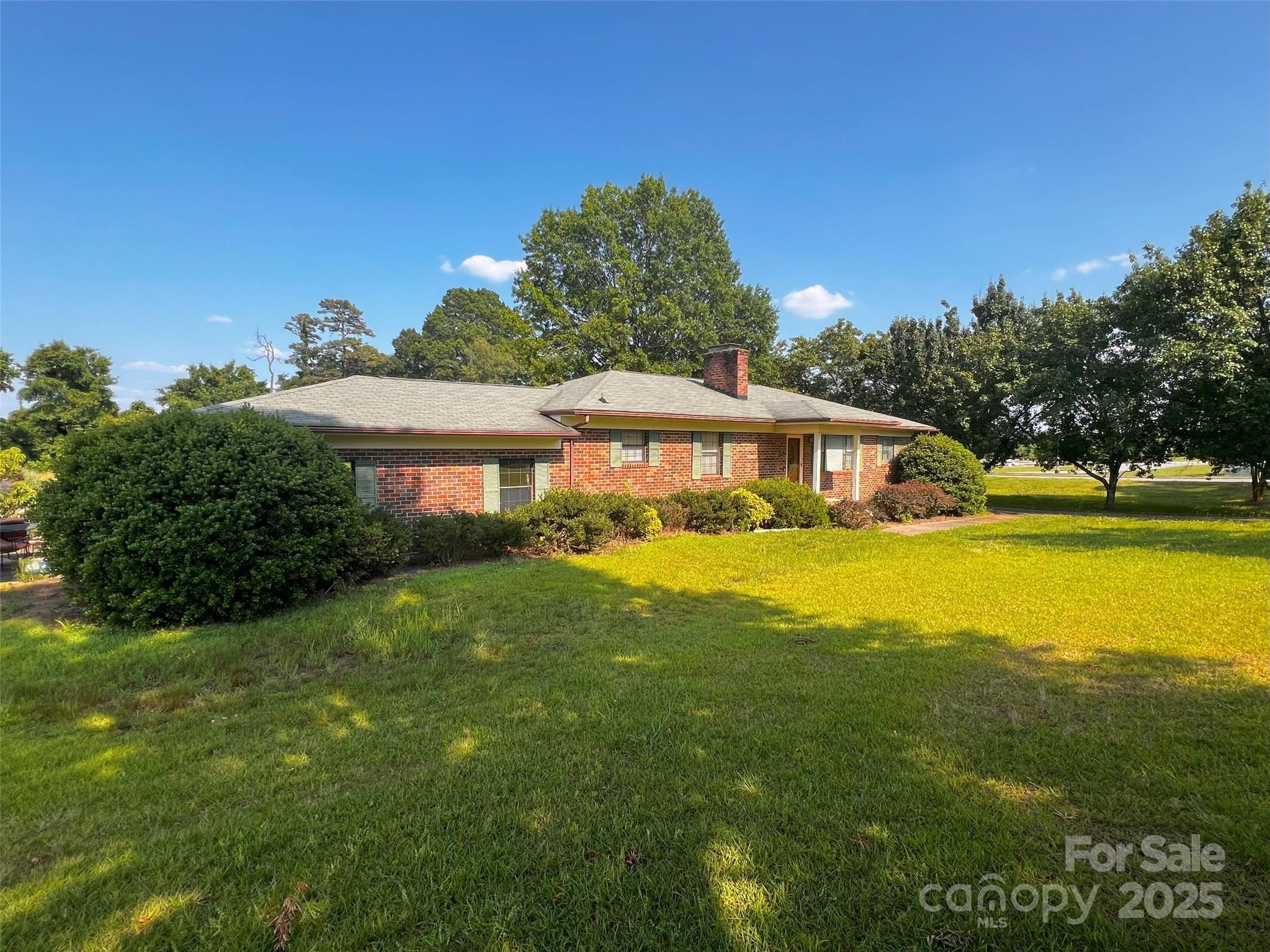 1243 Cox Mill Road Concord, NC 28027 - Photo 2 of 6 a front view of house with yard and swimming pool