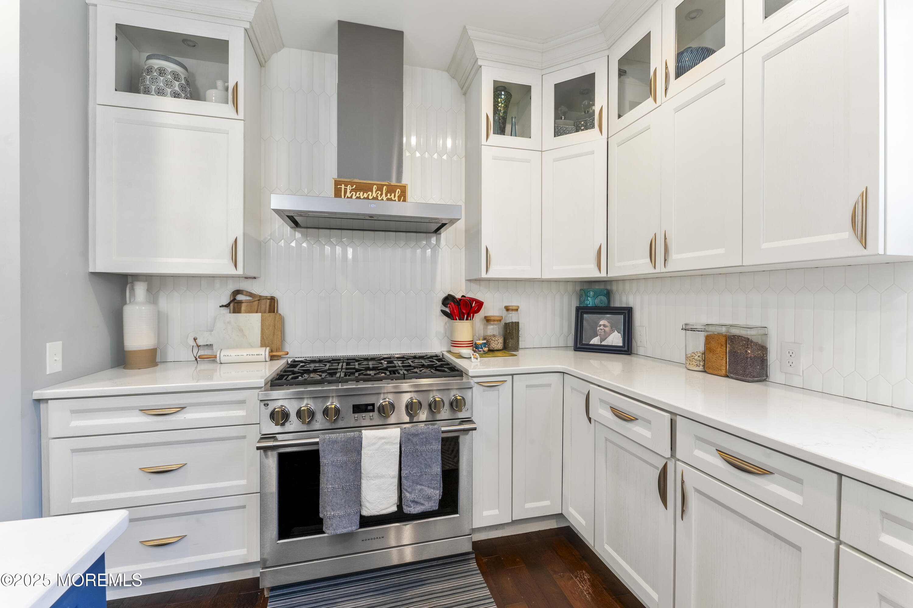 832 Holmdel Road Holmdel, NJ 07733 - Photo 14 of 44 a kitchen with stainless steel appliances granite countertop white cabinets and a stove