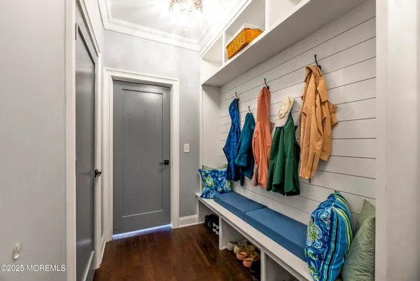 a view of walk in closet with clothes