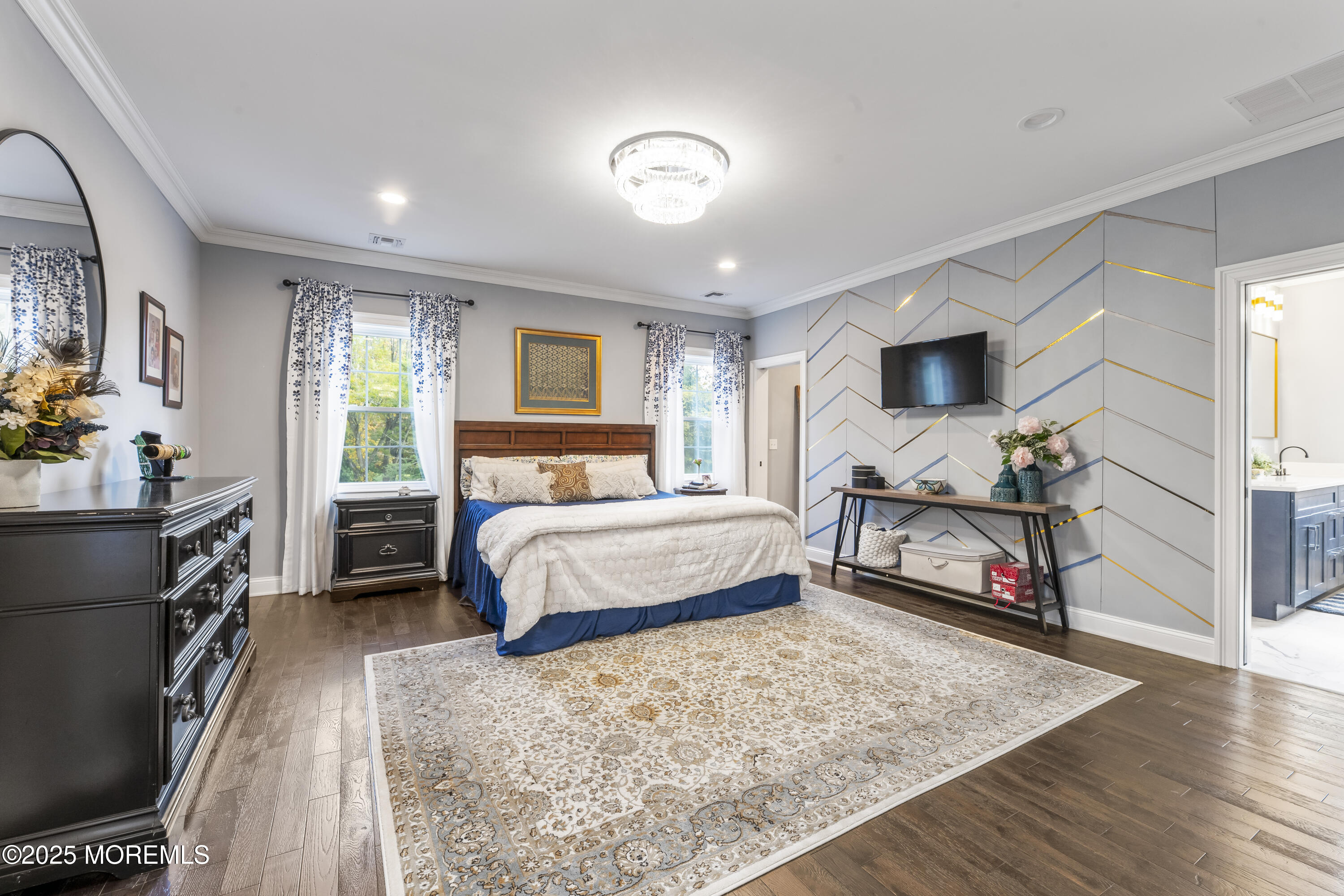 832 Holmdel Road Holmdel, NJ 07733 - Photo 28 of 44 a bedroom with a bed flat screen tv and a large window