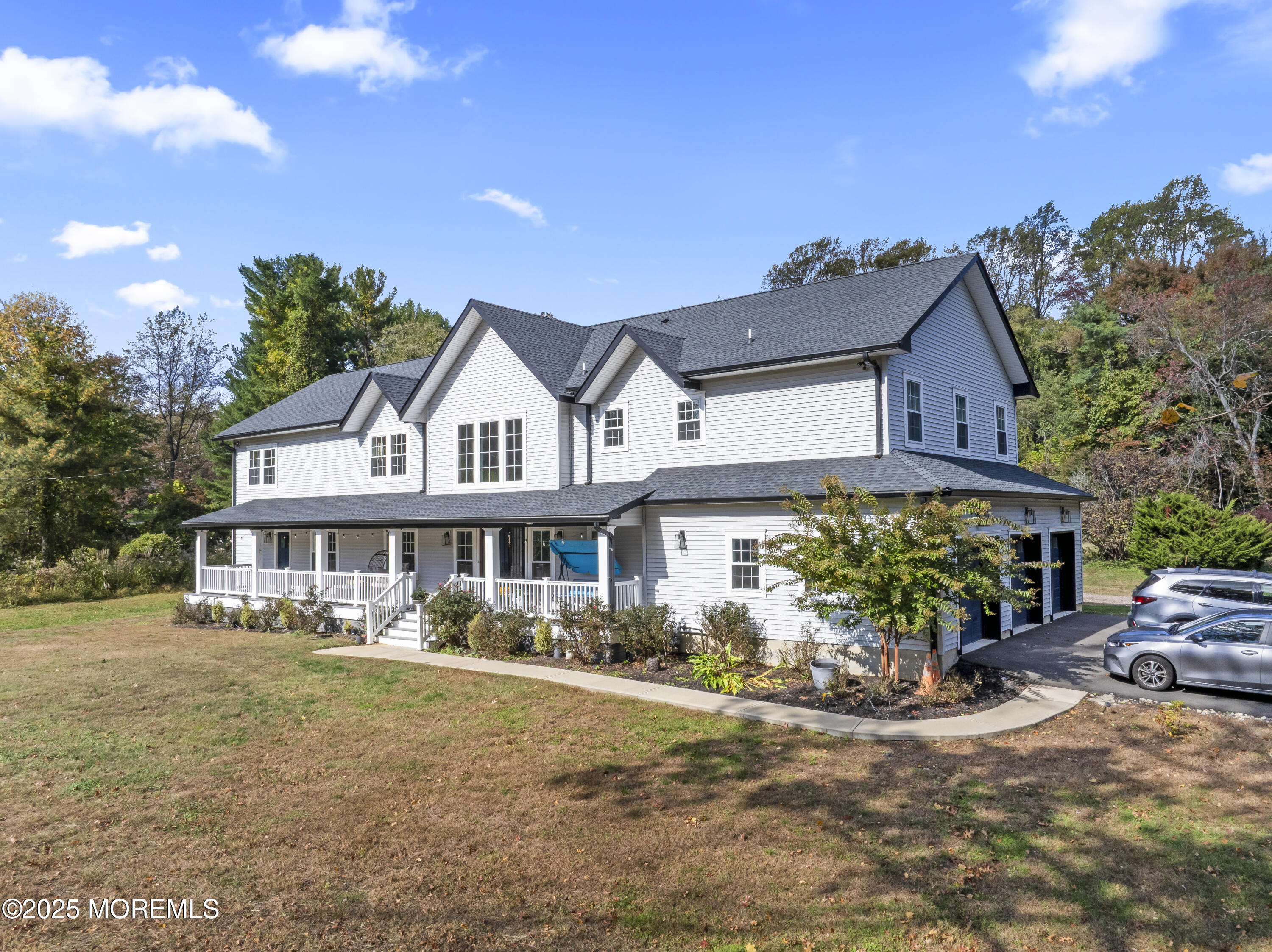 832 Holmdel Road Holmdel, NJ 07733 - Photo 3 of 44 a front view of a house with a garden