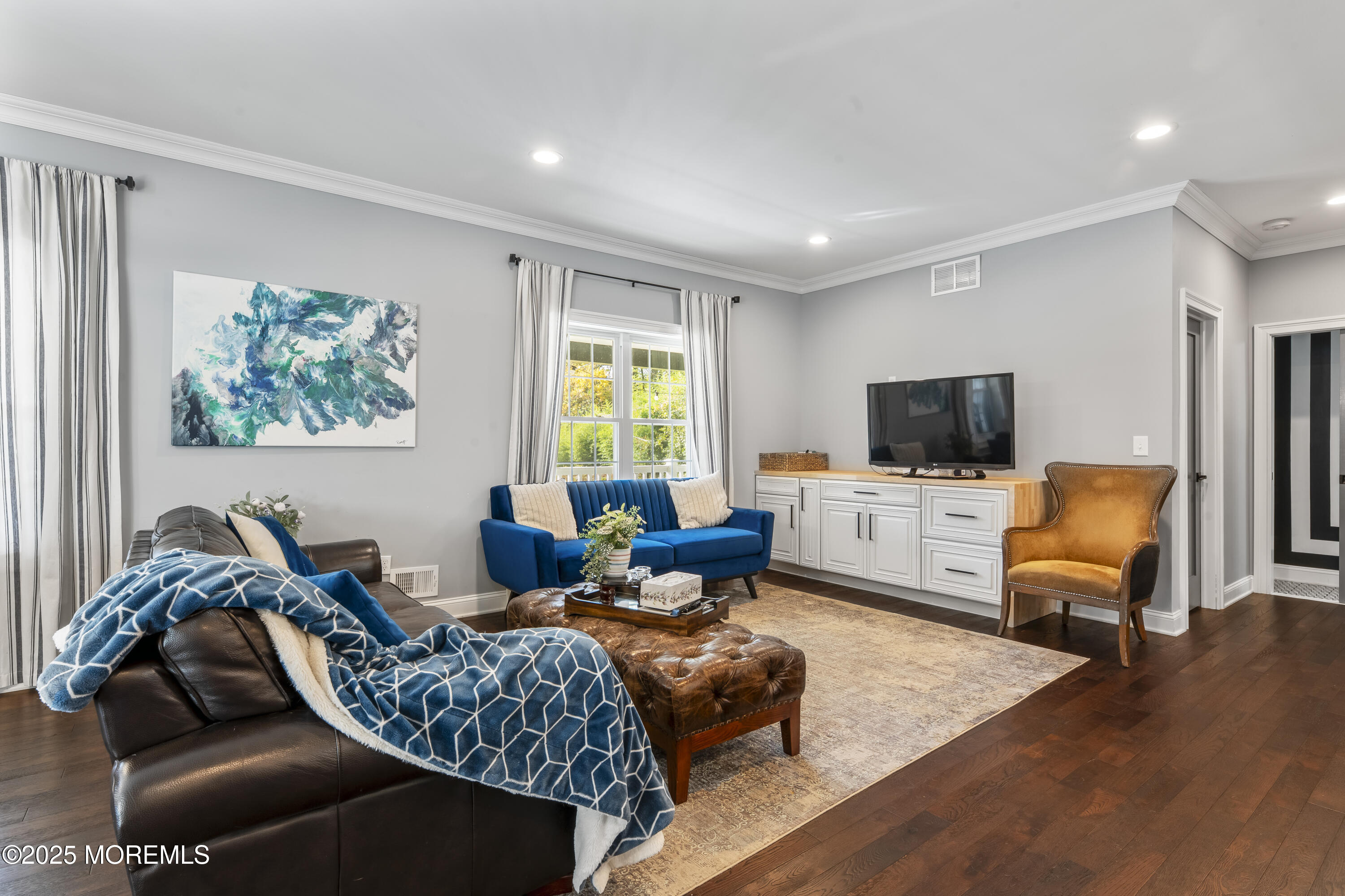 832 Holmdel Road Holmdel, NJ 07733 - Photo 33 of 44 a living room with furniture and a flat screen tv